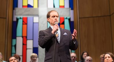 Pastor Paul (Anthony Fusco*) shares a revelation with his congregation.