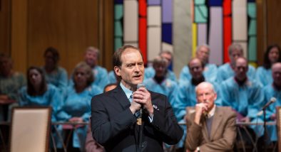 Pastor Paul (Anthony Fusco*) shares a revelation with his congregation.