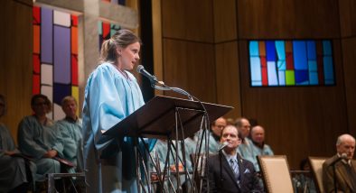 Jenny, a congregant (Millie Brooks) gives testimony to the congregation as Pastor Paul (Anthony Fusco*) and Elder Jay (Warren David Keith*) look on.