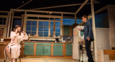 Sharon (Susi Damilano) is surprised that her new roommate, Robyn (Julia Brothers) smokes cigarettes.