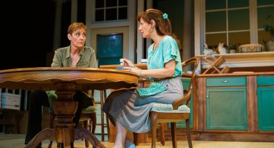 Robyn (Julia Brothers) and Sharon (Susi Damilano) discuss their plans over breakfast.