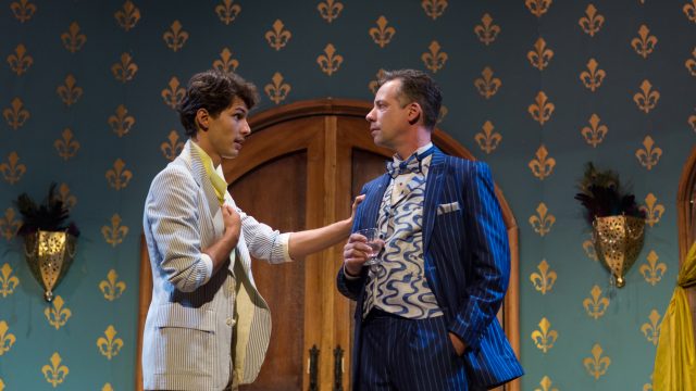 Jean-Michel (Nikita Burshteyn) shares some news with his father, Georges (Ryan Drummond*).