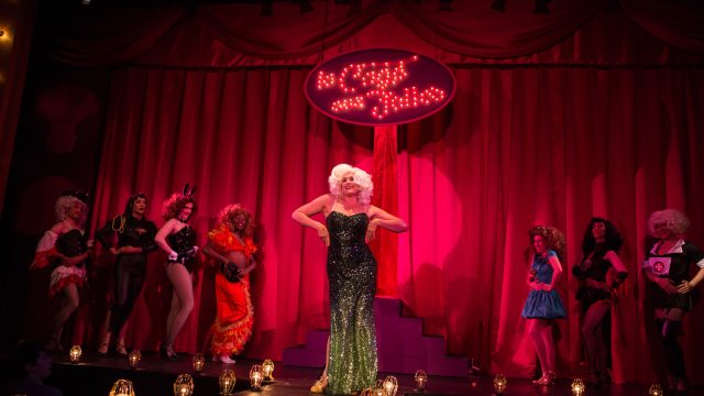 Marie Dindon (Adrienne Herro) takes the stage as a guest performer at La Cage aux Folles.
