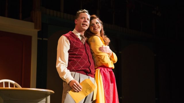 The Old Man (Ryan Drummond*) tells Mother (Abby Haug*) about his dream of winning the crossword puzzle.