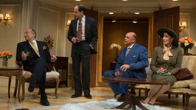 Senator Norval Hedges (Louis Parnell*), Ed Devery (Anthony Fusco*), Harry Brock (Michael Torres*), and Mrs. Hedges (Terry Bamberger) discuss ways to enrich Harry's business interests in the wake of World War II.