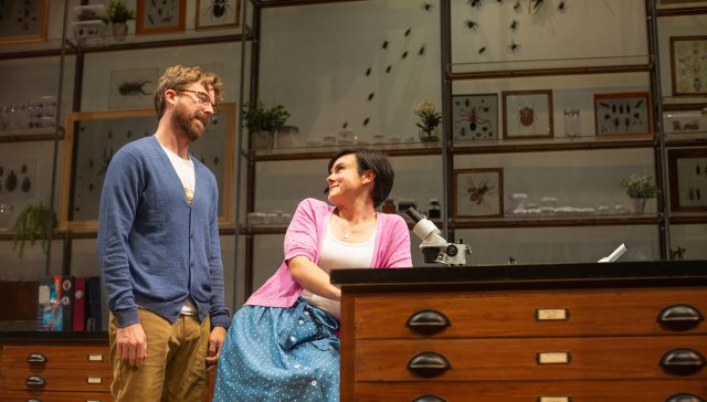 Lindsay (Jessica Lynn Carrol, right) examines insects under Jeff's (Lucas Verbrugghe) supervision.