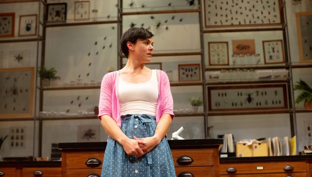 Lindsay (Jessica Lynn Carroll) waits in the entomology department in the Museum of Natural History.