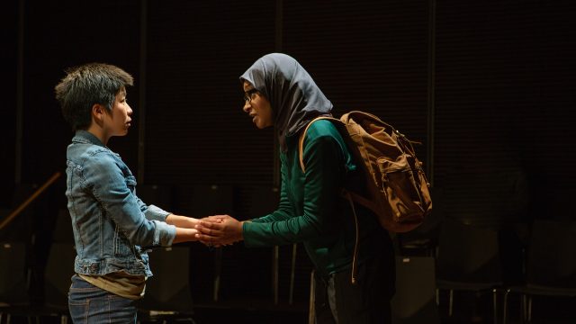 Sarah (Sango Tajima) receives a warning from Soha (Sam Jackson).