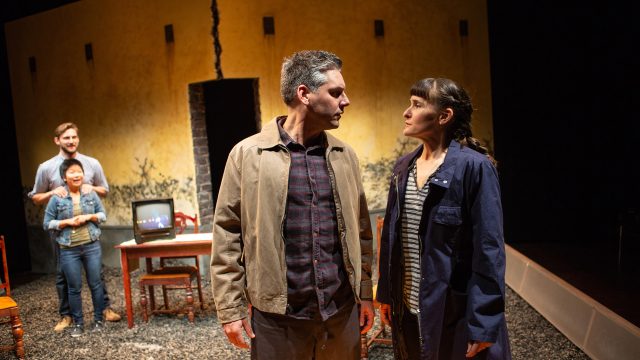 Austrian couple Alfred (Timothy Roy Redmond*) and Katrine (Elissa Beth Stebbins) show up at the inn in Braunau with mysterious motives. Justin (Josh Schell*) and Sarah (Sango Tajima) look on.