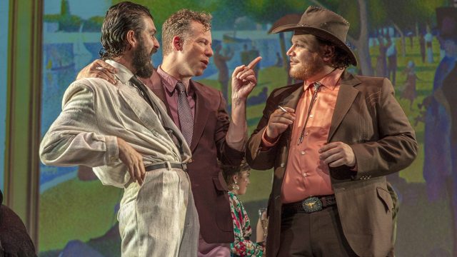 George (John Bambery*), Bob (Ryan Drummond*), and Charles Redmond (Zac Schuman), discuss Charles’s artwork.