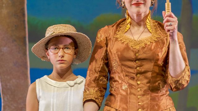 Louise (Gwen Herndon) and Yvonne (Abby Haug*) pose for George’s painting at the Île de la Grande Jatte.