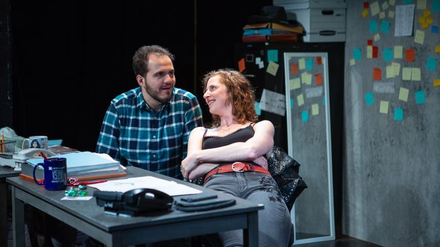 Mark (Vincent Randazzo*) and Kate (Jessica Bates*) share a moment during the workday at their proofreading office in Washington, D.C. Photo by Jessica Palopoli.