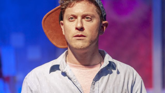 That Guy (Max Forman-Mullin) arrives in the office. Photo by Ken Levin.