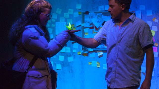 Sherri (Melissa Quine*) receives a gift from That Guy (Max Forman-Mullin). Photo by Ken Levin.