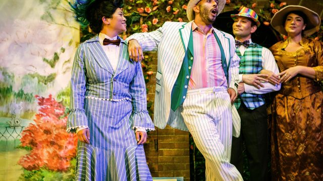 Mary Poppins (El Beh) and Bert (Wiley Naman Strasser) during a Jolly Holiday with other park strollers (Rudy Guerrero* and Sophia LaPaglia).