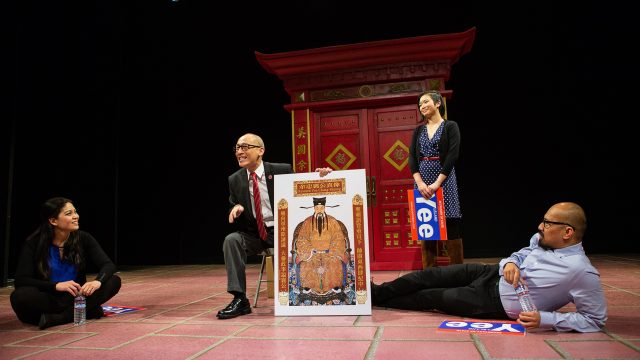Larry (Francis Jue*, center) explains Yee family history to Actor 2 (Rinabeth Apostol*), Lauren (Krystle Piamonte) and Actor 1 (Jomar Tagatac*) in 'King of the Yees' at San Francisco Playhouse.