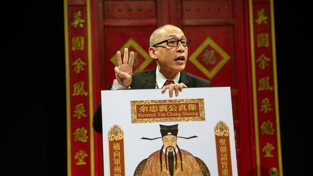 Larry (Francis Jue*) explains the history of the Yee family's "model ancestor" in 'King of the Yees' at San Francisco Playhouse.