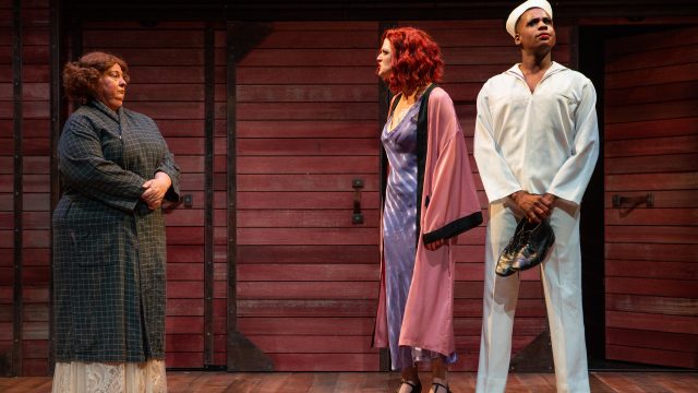 Fräulein Schneider (Jennie Brick*) confronts Fräulein Kost (Abby Haug*) and Rudy (Jean-Paul Jones) in 'Cabaret' at San Francisco Playhouse.