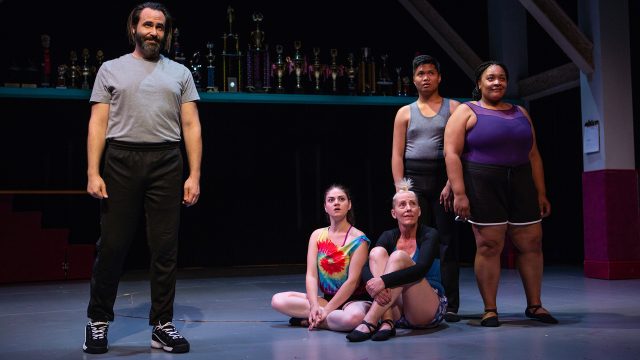 Dance Teacher Pat (Liam Robertson) coaches dancers Sofia (Ash Malloy), Maeve (Julia Brothers), Luke (Bryan Munar), and Amina (Indiia Wilmott).