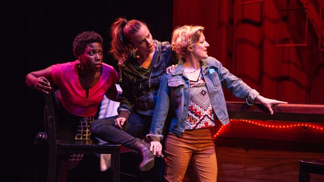 In 2015, Leslie (Jeunée Simon), Gina (Katie Rubin), and Natalie (Erin Anderson) get together at the Lexington Club on the bar's closing night.