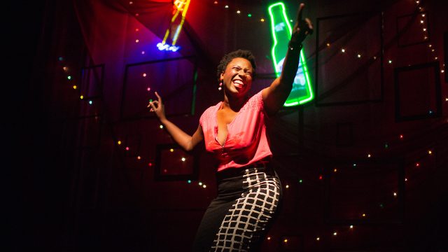 Leslie (Jeunée Simon) celebrates the last night of the Lexington Club.