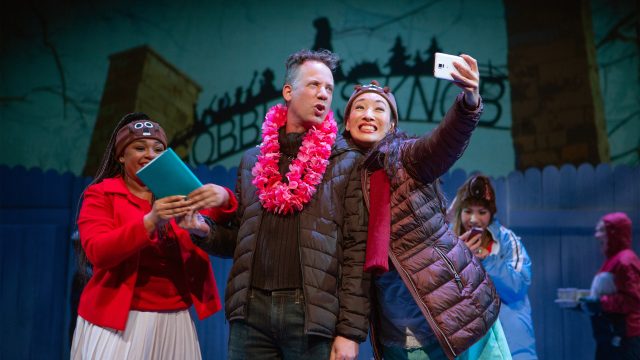 Debbie (Loreigna Sinclair) and Doris (Kathryn Hannah*) want to have a moment with the famous Phil Connors (Ryan Drummond*, center).