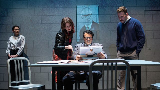 Anne (Ash Malloy*) meets with GDR government officials Lotte (Lauren Hart*), Erich (Christopher Reber*), and Hans (Patrick Andrew Jones*) to discuss Bruce Springsteen's upcoming concert in East Berlin. 'Born in East Berlin' by Rogelio Martinez at San Francisco Playhouse.