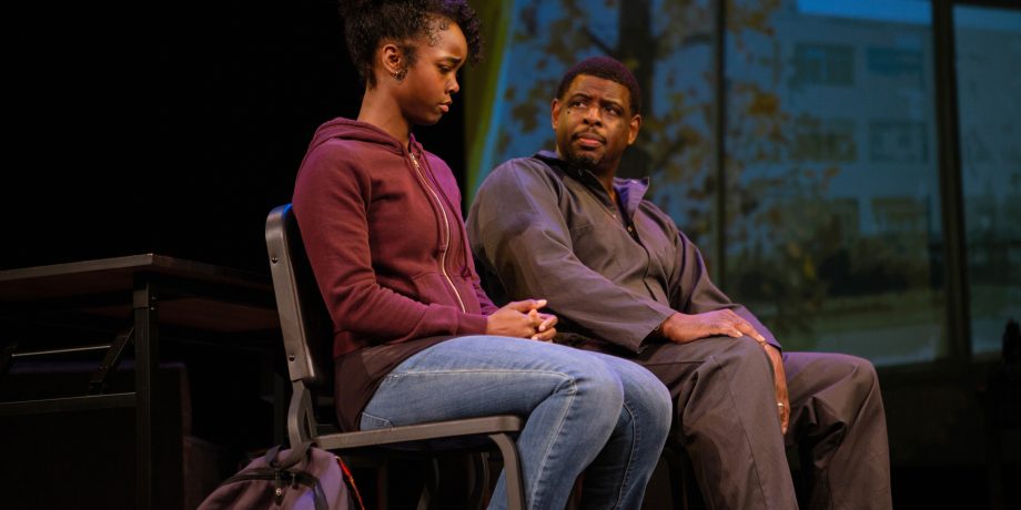Davis Despenza Hayes (Jamella Cross*) and her father Ernest Hayes (Khary L. Moye*) meet in the classroom of her new school.