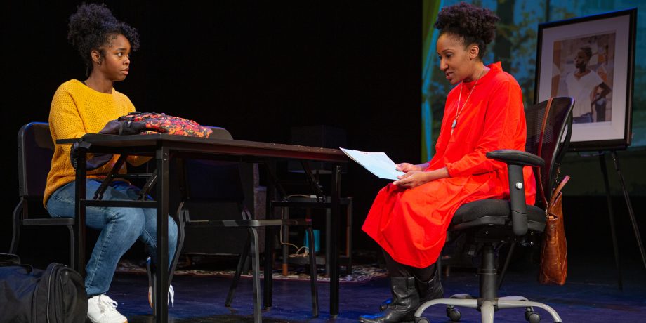 Davis (Jamella Cross*) talks about the strange symbol on her artwork with her teacher Ms. T. (Safiya Fredericks*).