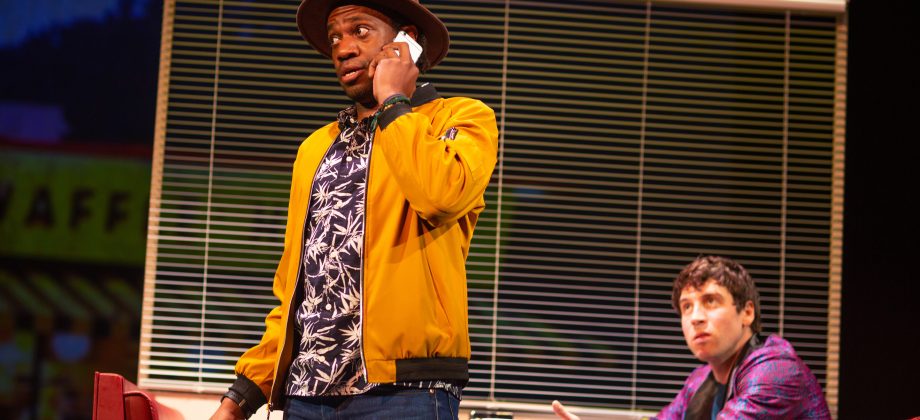 Joe (Reggie D. White*), Robbie (Jeremy Kahn*)'s manager, tries to grasp why Robbie would abandon a sold-out concert tour in 'The Song of Summer' at San Francisco Playhouse. The Song of Summer at San Francisco Playhouse - Photo by Jessica Palopoli