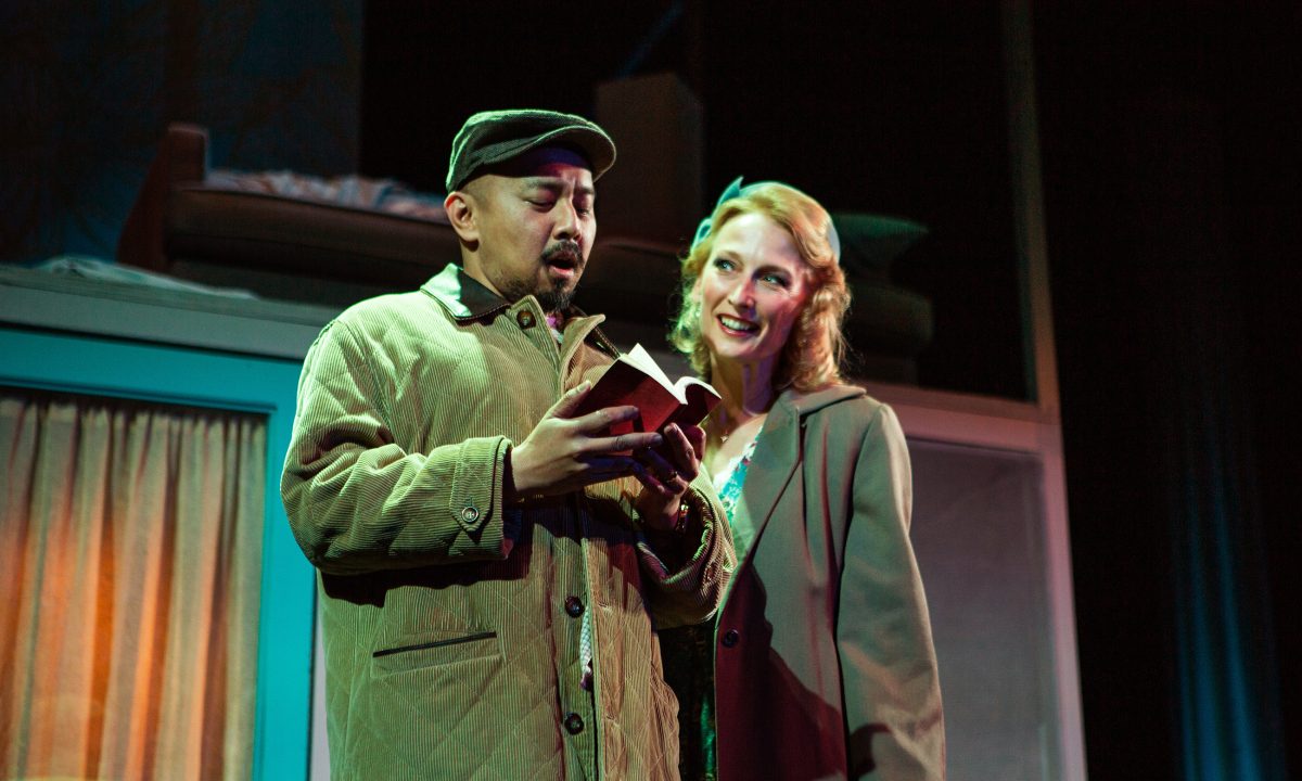 Harry (Jomar Tagatac*) relives a memory with his wife, Laura (Carrie Paff*) in 'The Paper Dreams of Harry Chin' at San Francisco Playhouse.