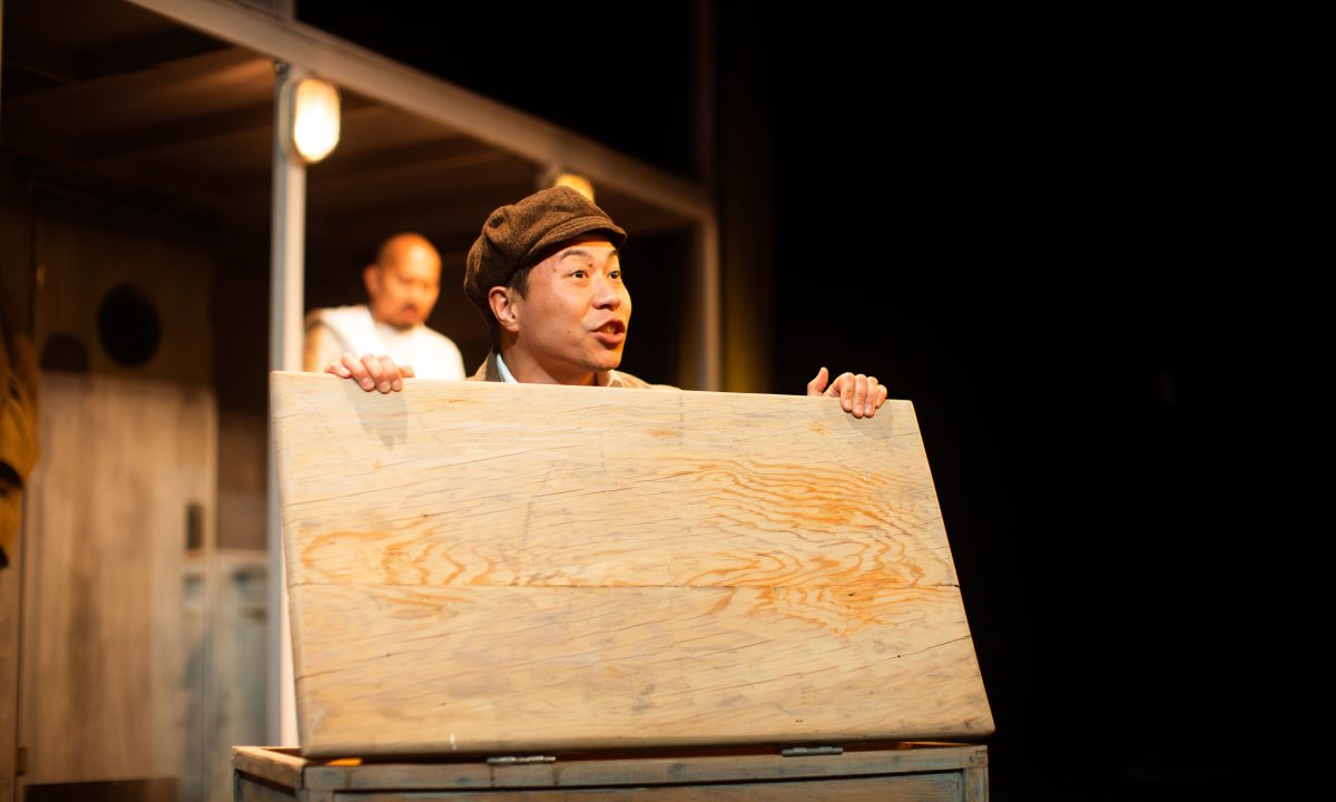 Poet (Will Dao*, front) and Harry (Jomar Tagatac*) plan for their arrival in America in 'The Paper Dreams of Harry Chin' at San Francisco Playhouse.