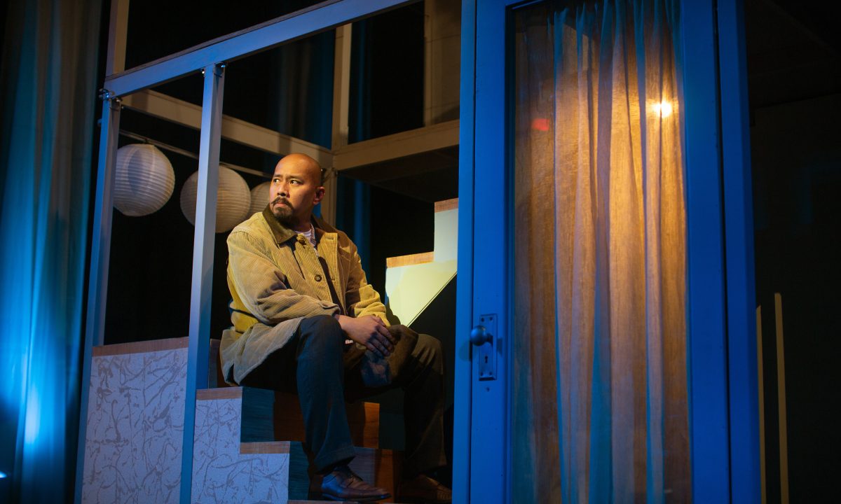 Harry (Jomar Tagatac*) prepares for arrival in the United States in 'The Paper Dreams of Harry Chin' at San Francisco Playhouse.