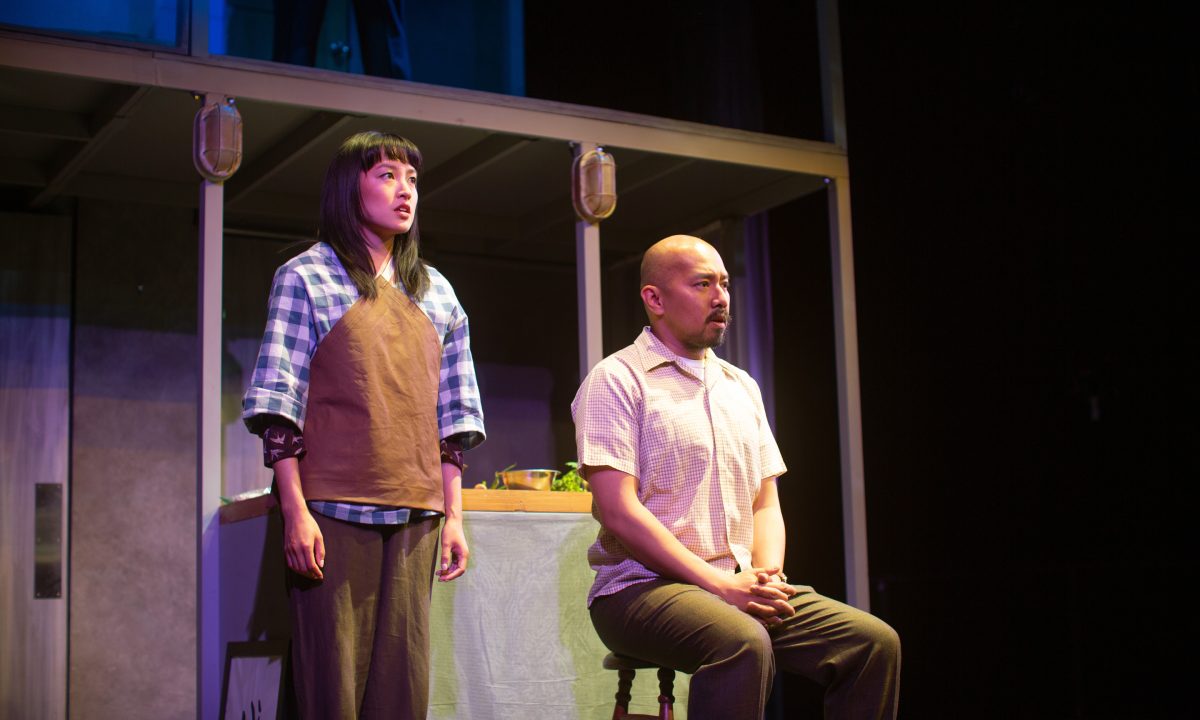 Yuet (Sharon Shao) and Harry (Jomar Tagatac*) relive a memory in 'The Paper Dreams of Harry Chin' at San Francisco Playhouse.