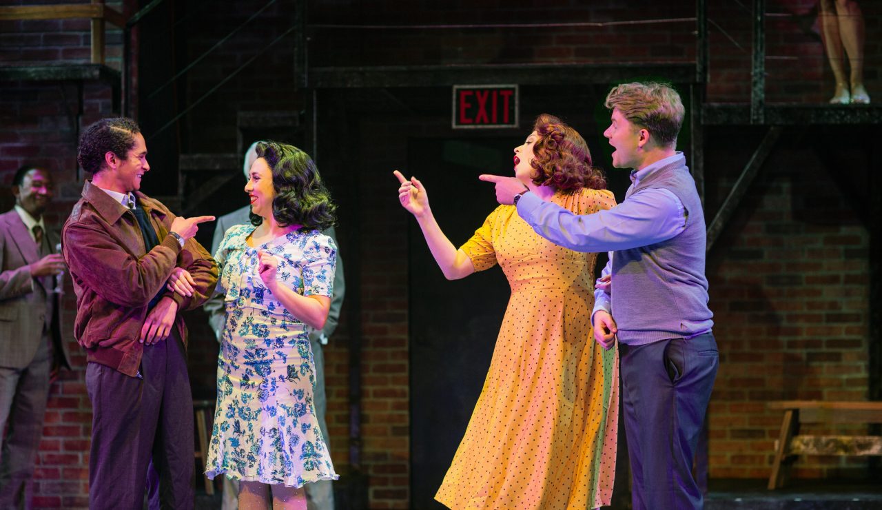 Buddy Plummer (Anthony Rollins-Mullens*) and Benjamin Stone (Chris Vettel*) look on as their younger selves (front row, L-R: Chachi Delgado as Young Buddy, Samantha Rose Cárdenas* as Young Sally, Danielle Cheiken as Young Phyllis, and Cameron La Brie as Young Ben) join in on Waiting for the Girls Upstairs.
