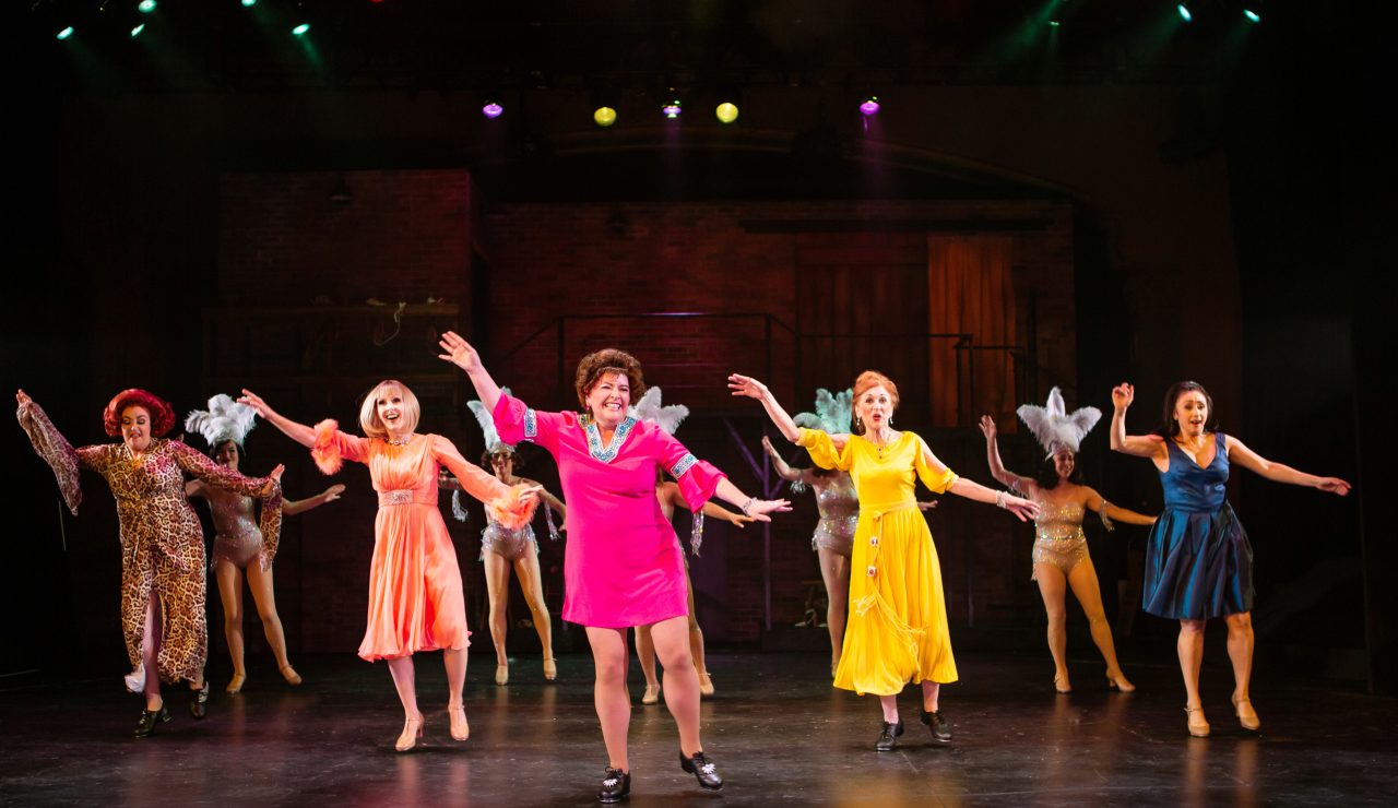 Former Follies performers (front row, L-R) Carlotta Campion (Cindy Goldfield*), Solange LaFitte (Jill Slyter), Stella Deems (Caroline Louise Altman*), Phyllis Rogers Stone (Maureen McVerry*), and Sally Durant Plummer (Natascia Diaz*) perform the iconic 'Who’s That Woman?', joined by the ghosts of Follies past as their mirror-images (L-R: Emily Corbo, Ann Warque, Catrina Manahan, Danielle Cheiken, and Samantha Rose Cárdenas*).
