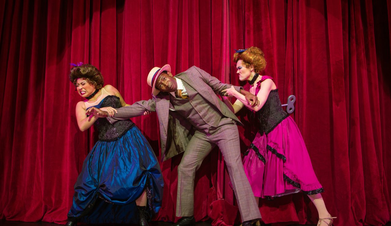 Buddy Plummer (Anthony Rollins-Mullens*, center) grapples with life’s dilemmas in 'The-God-Why-Don't-You-Love-Me-Blues,' accompanied by featured dancers Catrina Manahan (left) and Emily Corbo (right).