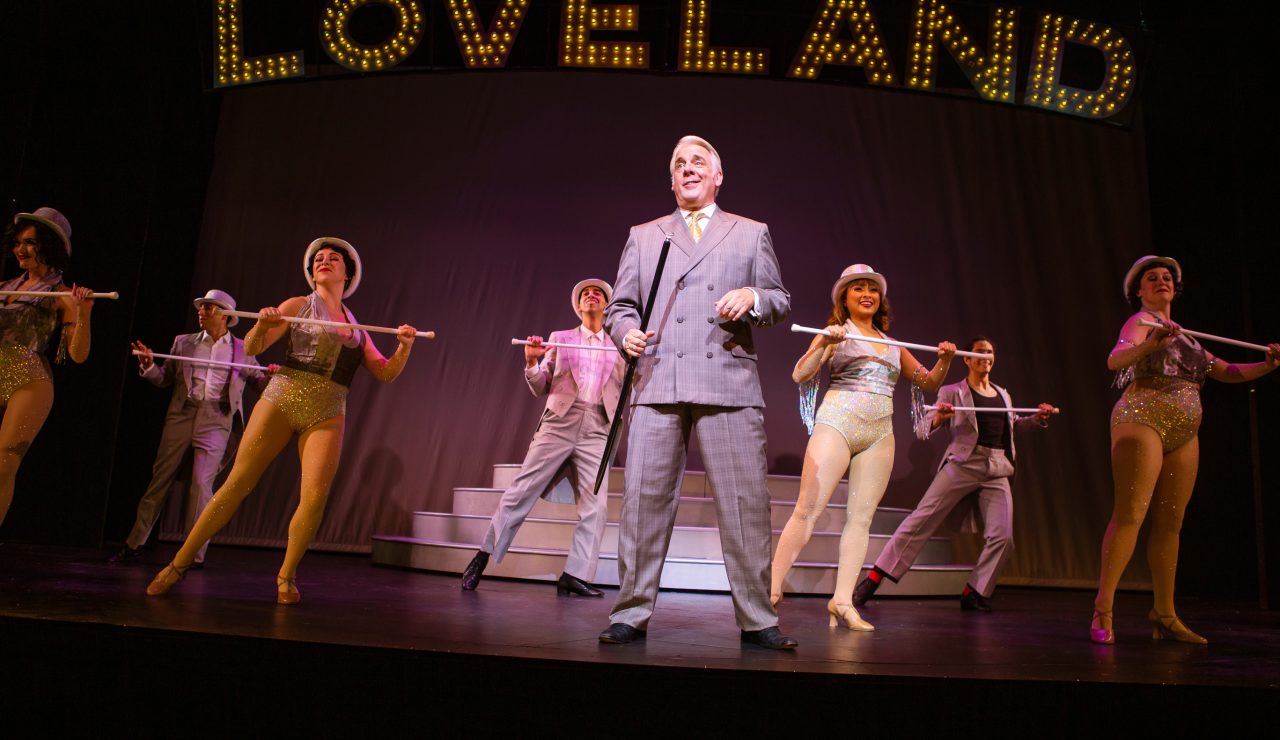 Benjamin Stone (Chris Vettel*, center) reevaluates his priorities during 'Live, Laugh, Love,' accompanied by the Follies company (L-R: Emily Corbo, Anthony Maglio, Samantha Rose Cárdenas*, M. Javi Harnly, Catrina Manahan, Chachi Delgado, and Danielle Cheiken).