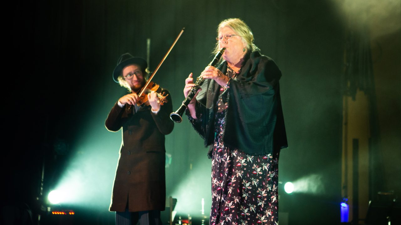 Matthew Stein (left) as Mayer Balsam, on violin, and Audrey Jackson (right) as Nelly Friedman, on clarinet, in 'Indecent' by Paula Vogel at San Francisco Playhouse. Production photography by Jessica Palopoli.