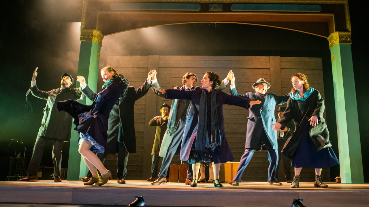The troupe breaks into joyous klezmer song and dance (L-R): Lemml (Dean Linnard*), Halina (Rivka Borek*), Mayer Balsam (Matthew Stein), on violin, Avram (Billy Cohen*), Vera (Rachel Botchan*), Otto (Victor Talmadge*), Moriz Godowsky (Dmitri Gaskin), on accordion, and Chana (Malka Wallick*). Production photography by Jessica Palopoli for 'Indecent' by Paula Vogel at San Francisco Playhouse.