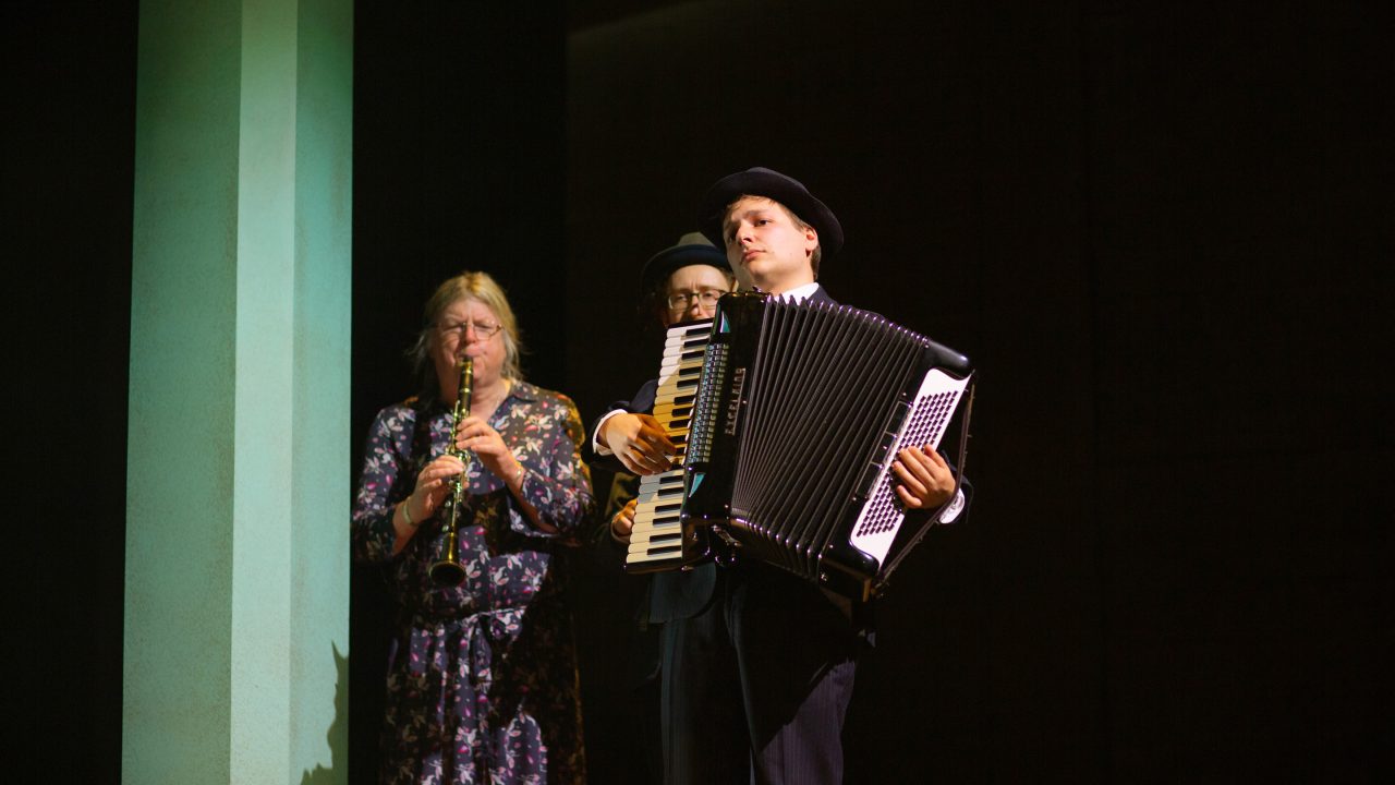 The musicians of 'Indecent' (L-R): Audrey Jackson as Nelly Friedman, on clarinet, Matthew Stein as Mayer Balsam, on violin, and Dmitri Gaskin as Moriz Godowsky, on accordion. Production photography by Jessica Palopoli for 'Indecent' by Paula Vogel at San Francisco Playhouse.