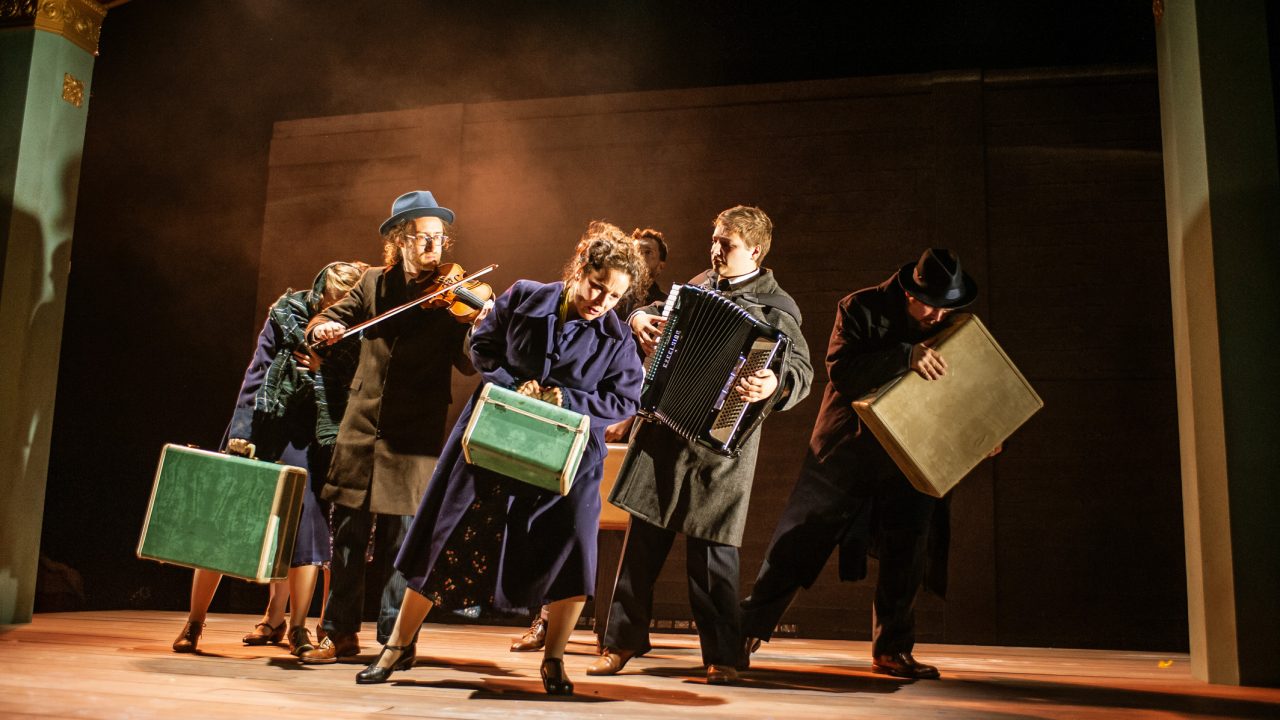 The troupe makes its long journey to America (L-R): Halina (Rivka Borek*), Mayer Balsam (Matthew Stein), on violin, Vera (Rachel Botchan*), Lemml (Dean Linnard*), Moriz Godowsky (Dmitri Gaskin), on accordion, and Mendel (Ted Zoldan). Production photography by Jessica Palopoli for 'Indecent' by Paula Vogel at San Francisco Playhouse.
