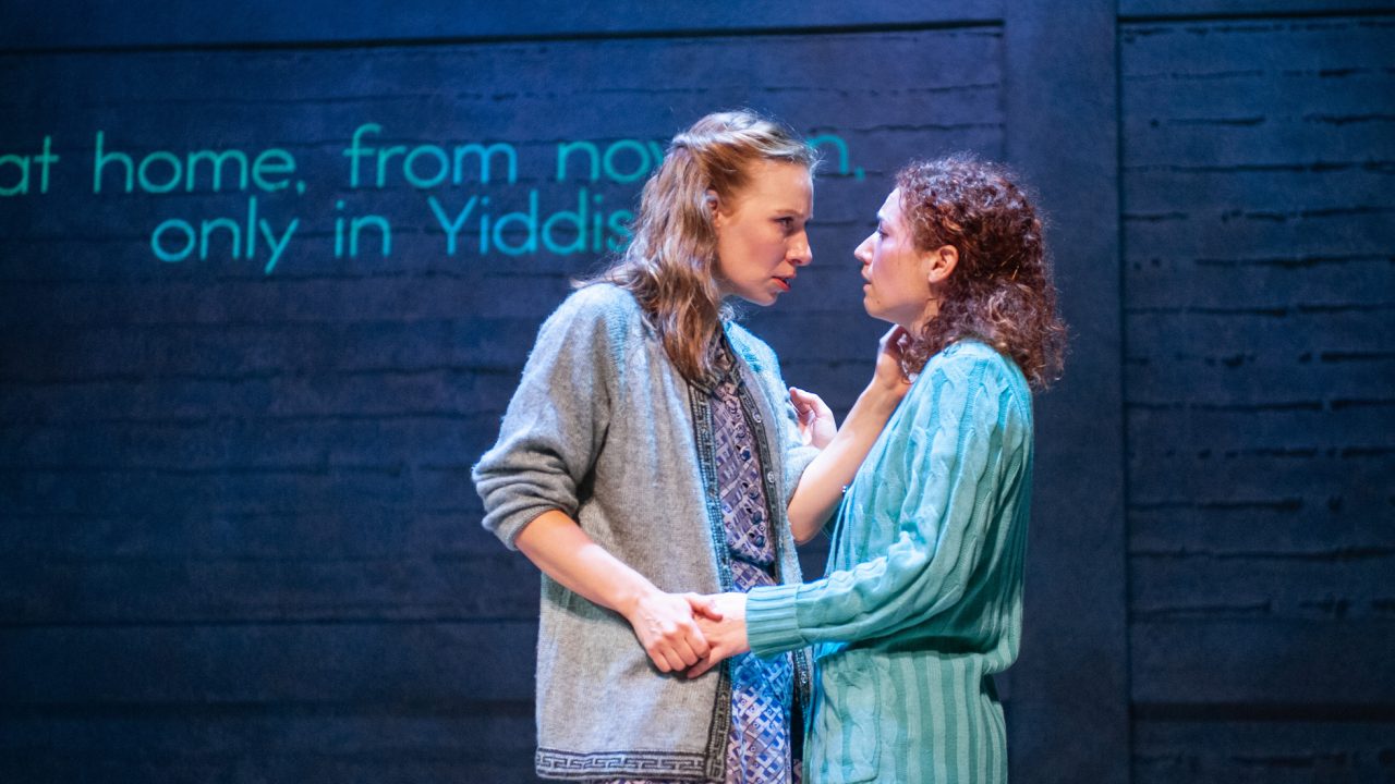 The troupe tells the story of the arrests of the cast and producer following the Opening Night of 'The God of Vengeance' on Broadway: Dorothee Nelson, played by Halina (Rivka Borek*, left), is surprised to see Reina, played by Chana (Malka Wallick*, right), after her night in jail. Production photography by Jessica Palopoli for 'Indecent' by Paula Vogel at San Francisco Playhouse.