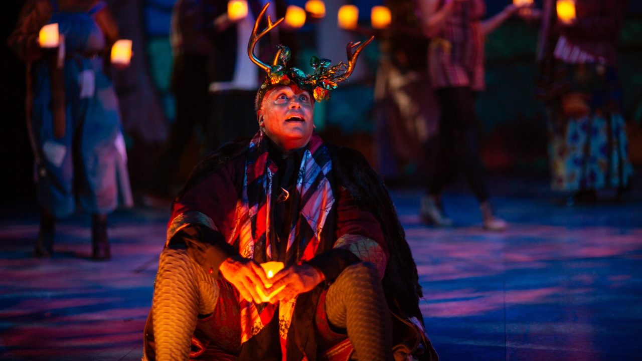 Duke Senior (Michael Gene Sullivan) revels in the community found in the forest of Arden in San Francisco Playhouse's musical version of "As You Like It," performing now through January 14, 2023.