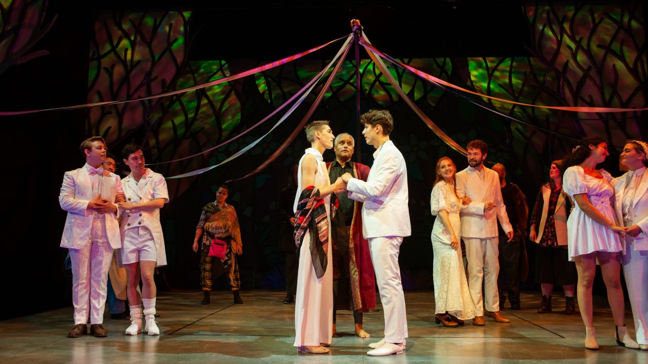 Couples embrace in a quadruple wedding ceremony in San Francisco Playhouse's musical version of "As You Like It," performing now through January 14, 2023.