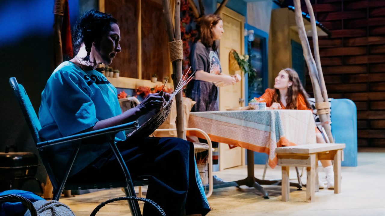Virginia's (Lisa Ramirez) basket making skills are recounted by Rocky (Rainbow Dickerson) to her daughter Maya (Louisa Kizer) in San Francisco Playhouse's World Premiere of "Cashed Out," performing January 26 - February 25.
