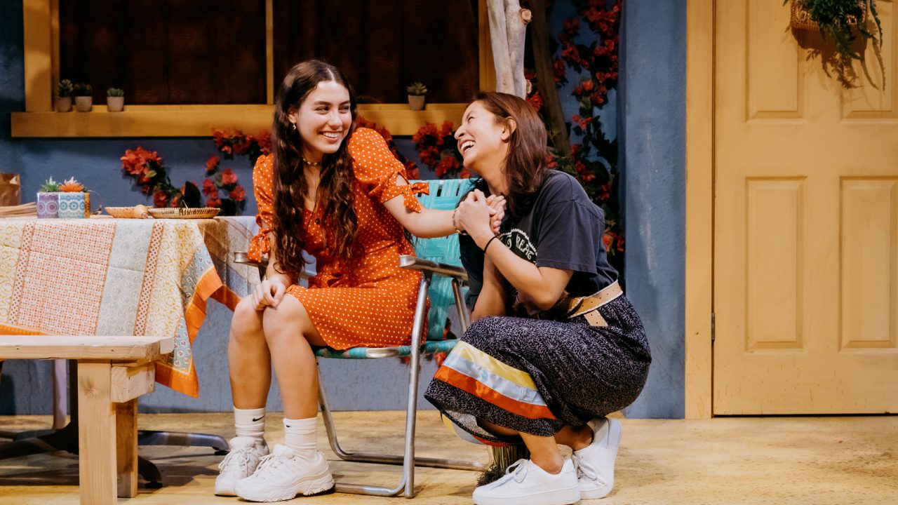 Maya (Louisa Kizer) is doted upon by her mom Rocky (Rainbow Dickerson) in San Francisco Playhouse's World Premiere of "Cashed Out," performing January 26 - February 25.