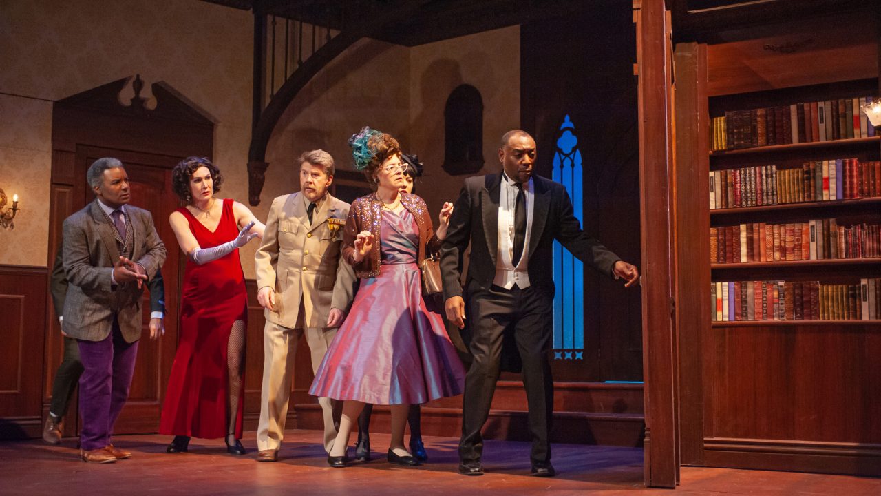 Miss Scarlet (Courtney Walsh), Colonel Mustard (Michael Ray Wisely), Mrs. Peacock (Stacy Ross), Mrs. White (Renee Rogoff), and Wadsworth (Dorian Lockett) peer into the library in San Francisco Playhouse's "Clue," performing March 9 - April 22.