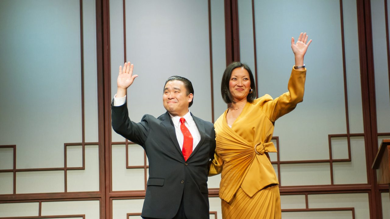 Judge Xu Geming (Phil Wong) and Xi Yan (Nicole Tung) greet a crowd in San Francisco Playhouse's "Chinglish," performing May 4 - June 10.