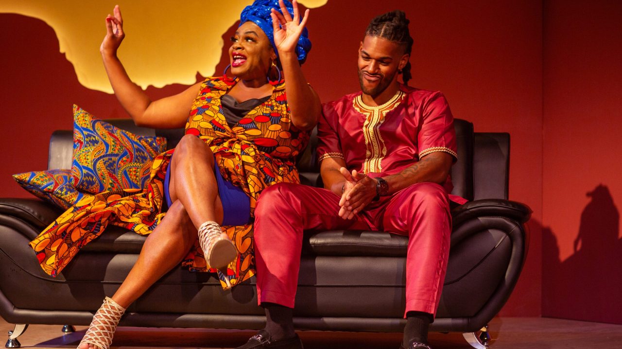 Talk show host Adenikeh (Tanika Baptiste) interviews Nigerian film director Gbenga (Tre’Vonne Bell) in San Francisco Playhouse's "Nollywood Dreams," performing September 28 - November 4, 2023.